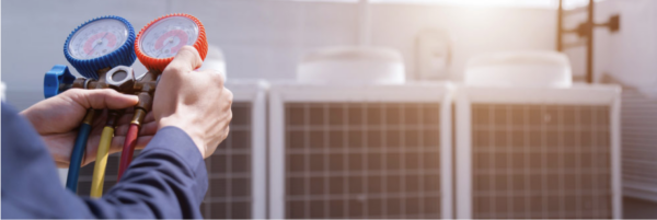 man fixing AC unit